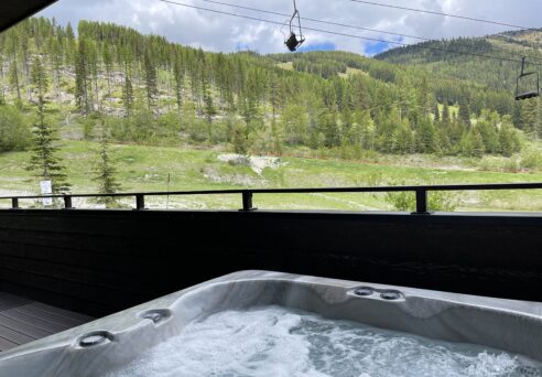 View from the hot tub at Glacier Bear Condo. A true ski-in ski-out chalet. Beautiful scenery awaits your summer, fall, spring or winter vacation in Montana. Lots of hiking and biking paths to choose from. Beautiful Lakes to See on your ride inside GNP. Stay at one of the best vacation rental properties in Northwest Montana. Whitefish Glacier Vacations has getaways in West Glacier National Park, slopeside ski condos on Big Mountain to luxury downtown townhomes, we have the best lodging in to choose from. For couples to groups to wedding parties and reunions. Enjoy nearby communities of Kalispell, Columbia Falls, Hungry Horse and Bigfork. Drive the Going-To-The-Sun-Road
